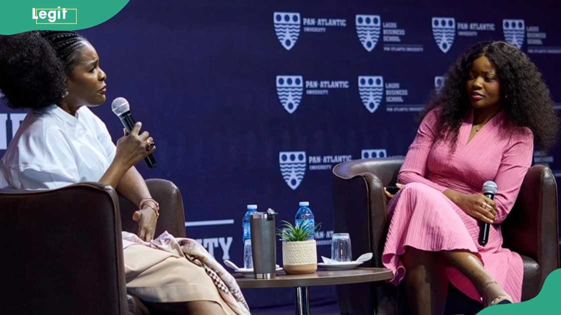 Two women are discussing at a table Two women are discussing at a table