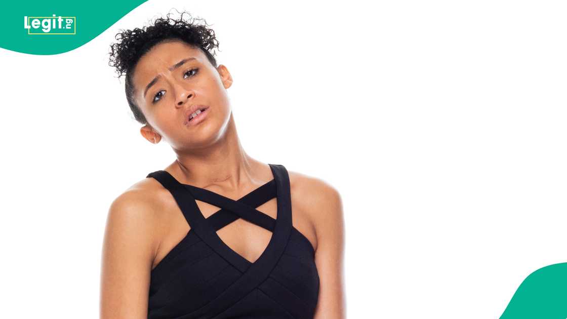 Lady looks uneasy in a black dress Lady looks uneasy in a black dress