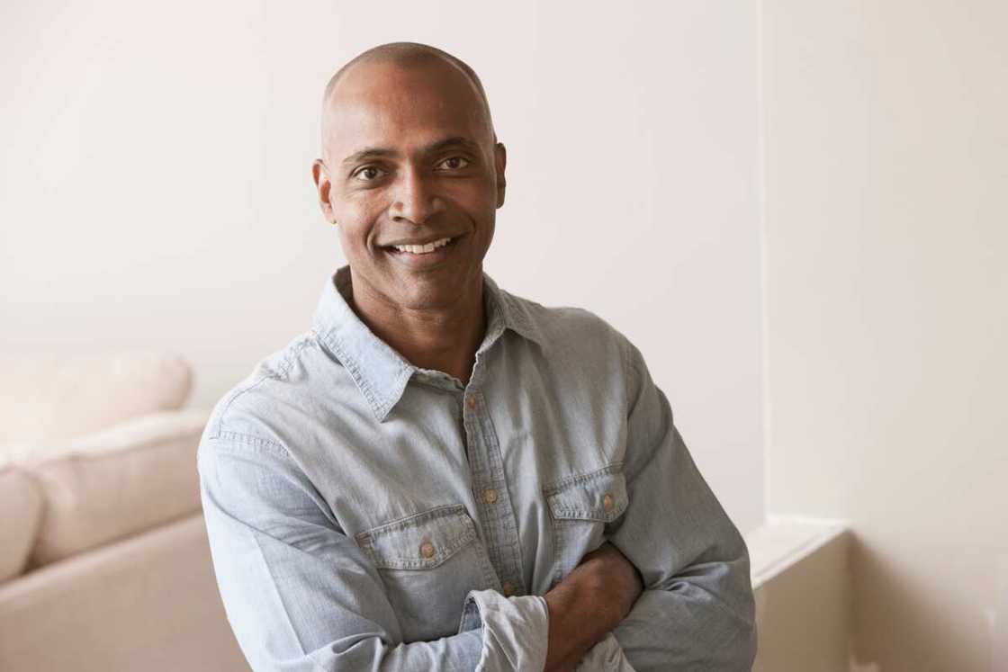 A man sitting on the couch smiling