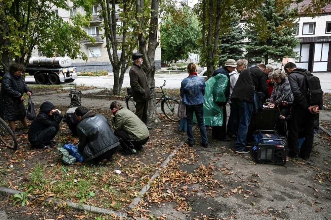 Local people barely pay attention to the mortar shells whistling overhead Local people barely pay attention to the mortar shells whistling overhead