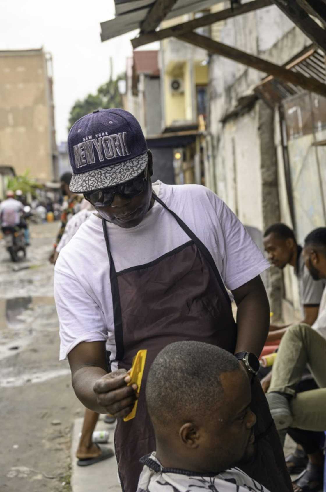 Anyone working in the street has to put up with bad weather and police 'fines' for alleged infringements Anyone working in the street has to put up with bad weather and police 'fines' for alleged infringements