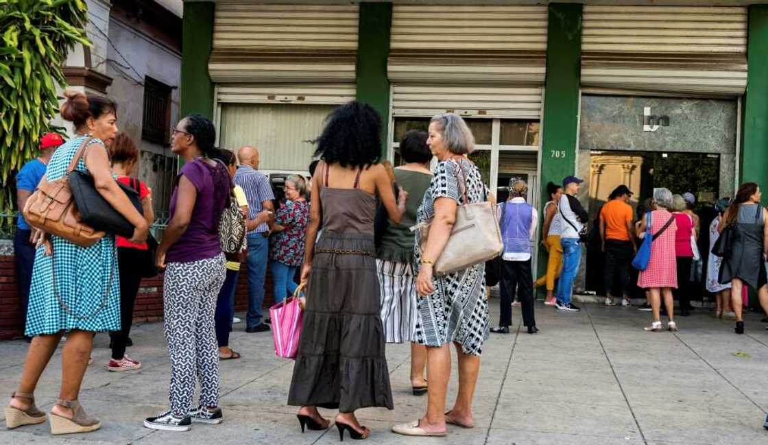 Long wary of the country's poorly functioning banks, Cubans have in recent months embraced cash even more, to avoid long lines and withdrawal limits at ATMs Long wary of the country's poorly functioning banks, Cubans have in recent months embraced cash even more, to avoid long lines and withdrawal limits at ATMs