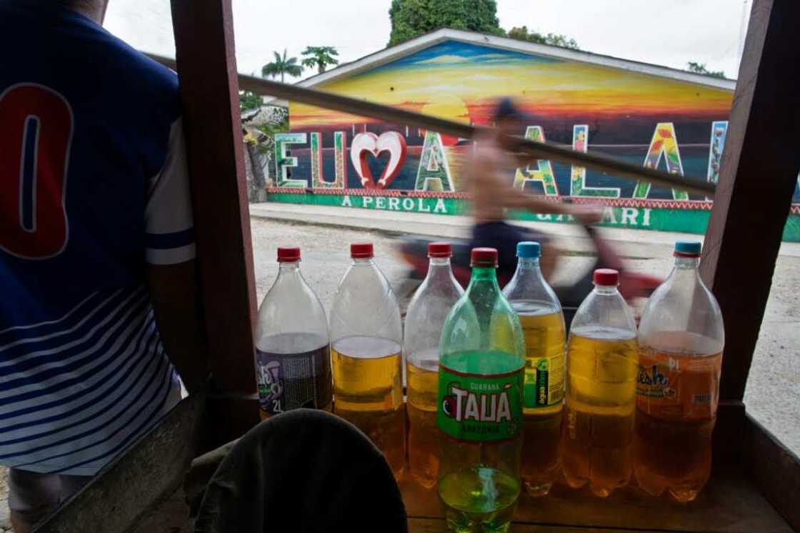 Gasoline is sold in plastic bottles in the streets of Atalaia do Norte Gasoline is sold in plastic bottles in the streets of Atalaia do Norte