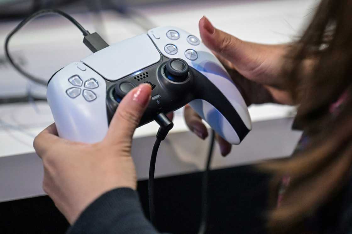 A member of the media tries out Sony's PlayStation 5 console during the Tokyo Game Show in Chiba City on September 26, 2024