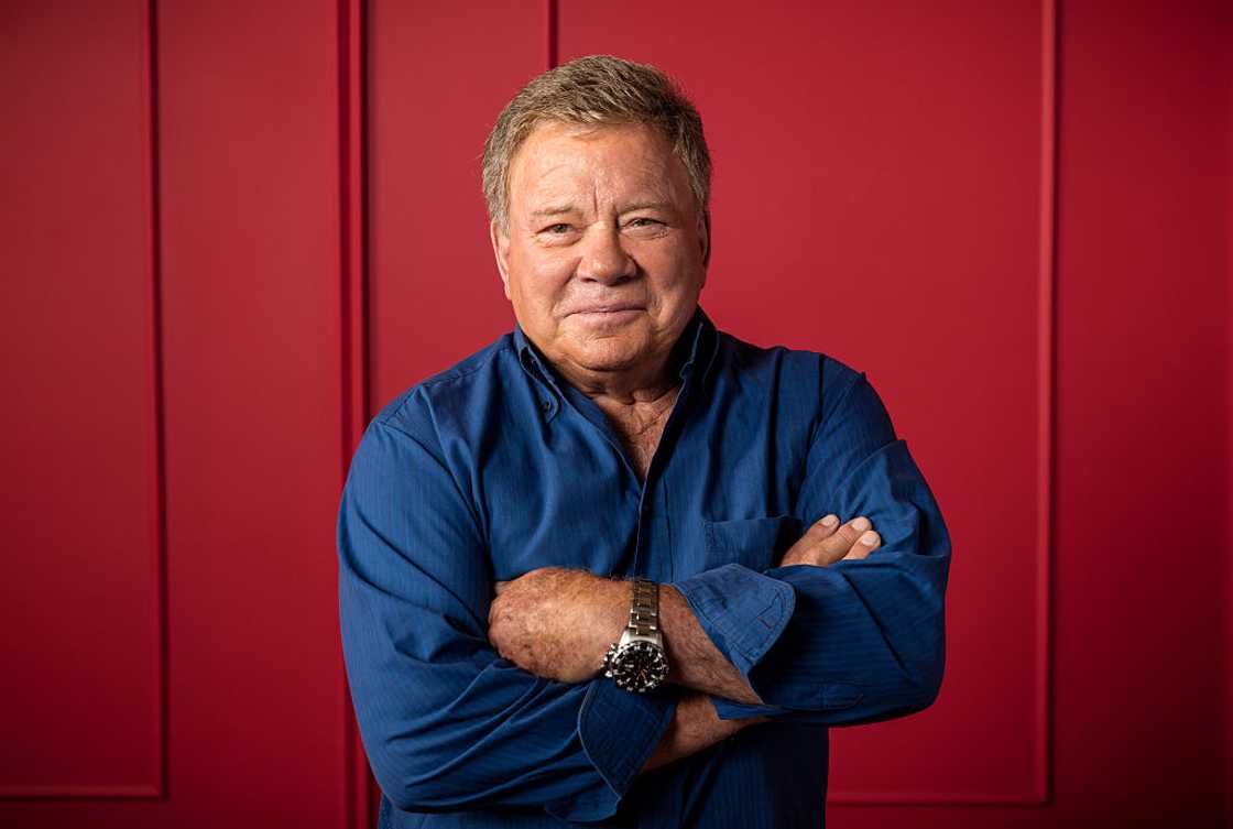 William Shatner, "Better Late Than Never", poses for a portrait in a blue shirt at The Beverly Hilton Hotel