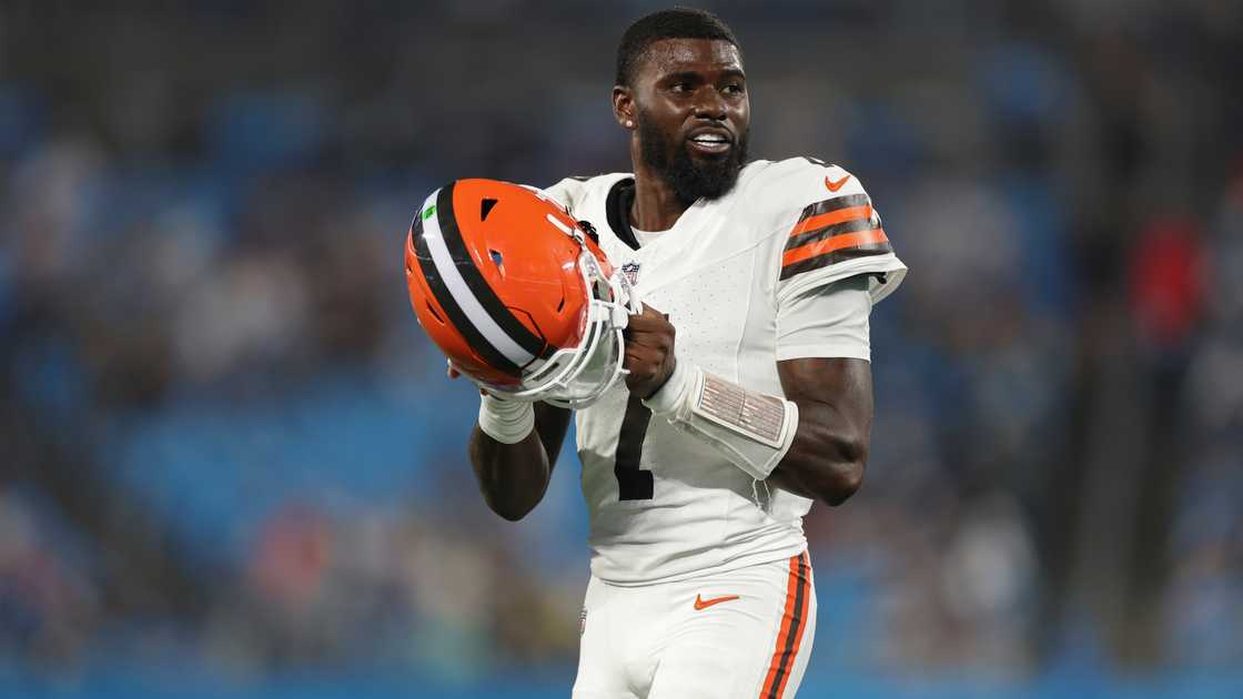 Tyler Huntley holds his helmet as he looks on during a game. Tyler Huntley holds his helmet as he looks on during a game.
