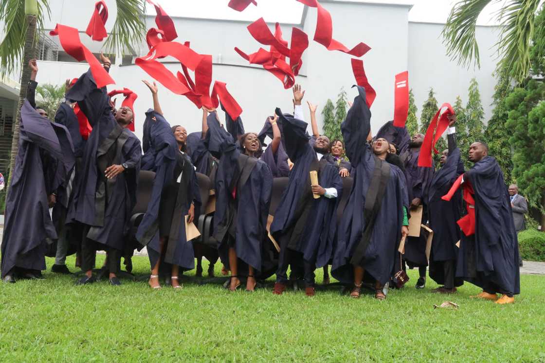 Graduating students in black gowns throw their caps in the air during a graduation ceremony at Lagos Business School, Ajah, Lagos, on 12 September 2019. Graduating students in black gowns throw their caps in the air during a graduation ceremony at Lagos Business School, Ajah, Lagos, on 12 September 2019.