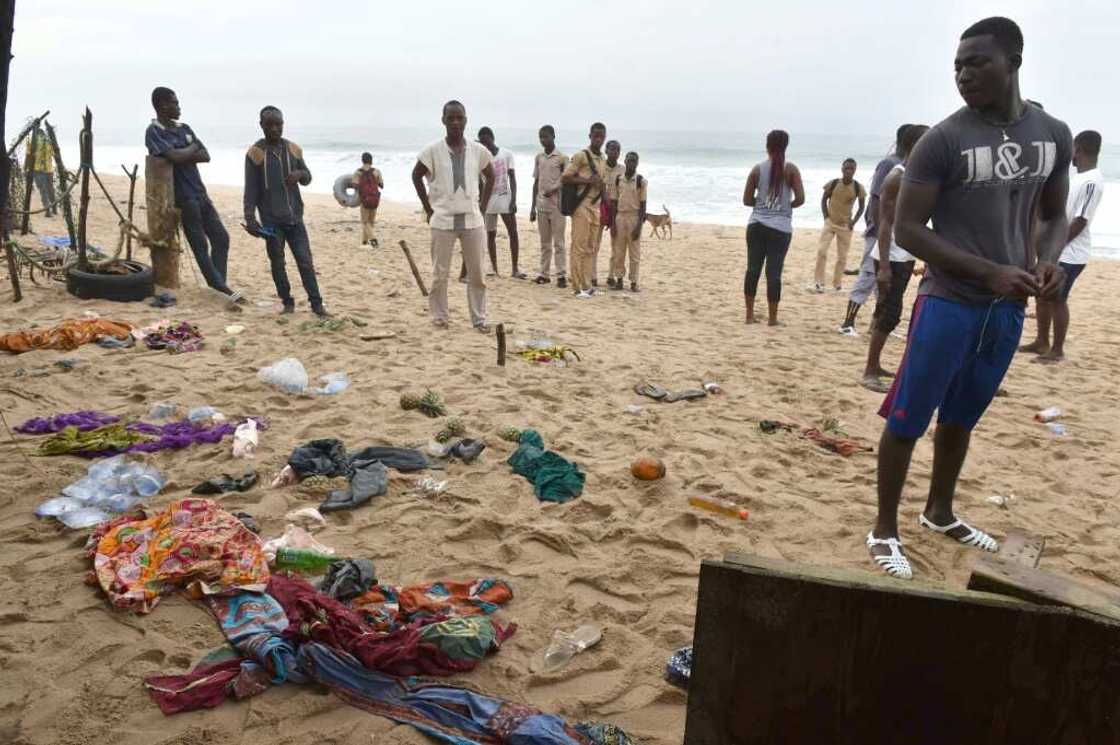 People look at clothes left on the beach following the attack People look at clothes left on the beach following the attack