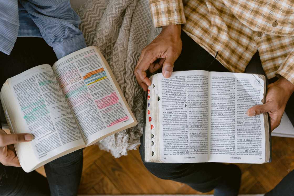 Two people reading the Bible