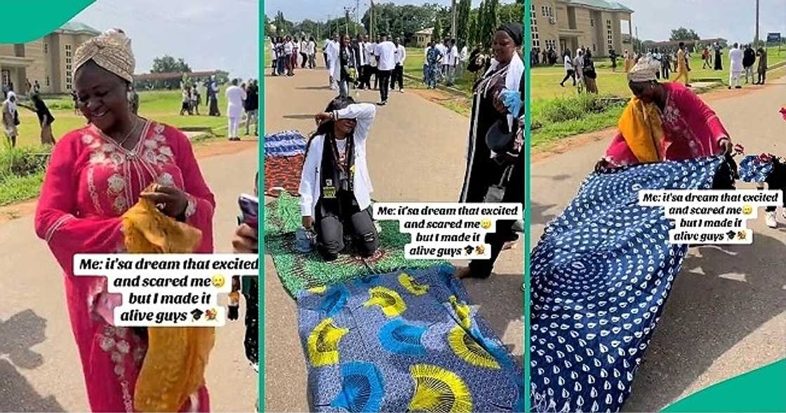 Mum lays her wrappers on the bare floor for her graduating daughter to walk on them. Mum lays her wrappers on the bare floor for her graduating daughter to walk on them.
