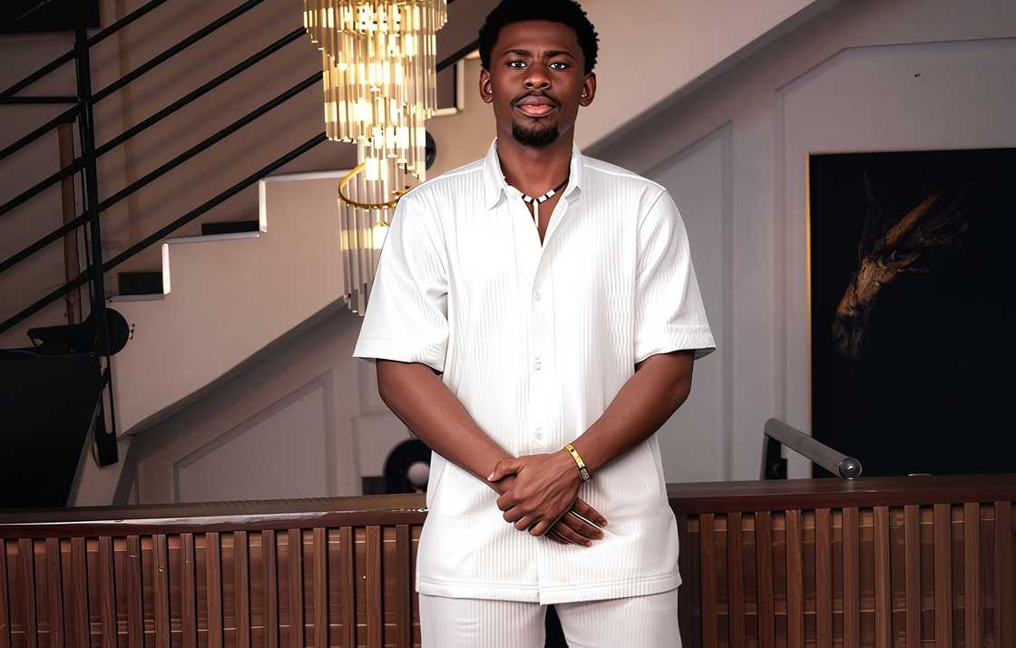 Victory from BBNaija takes a photo wearing all white indoors Victory from BBNaija takes a photo wearing all white indoors