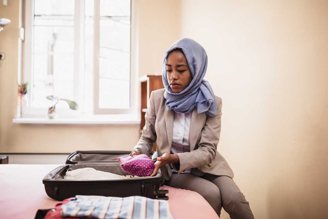 A muslim woman packing