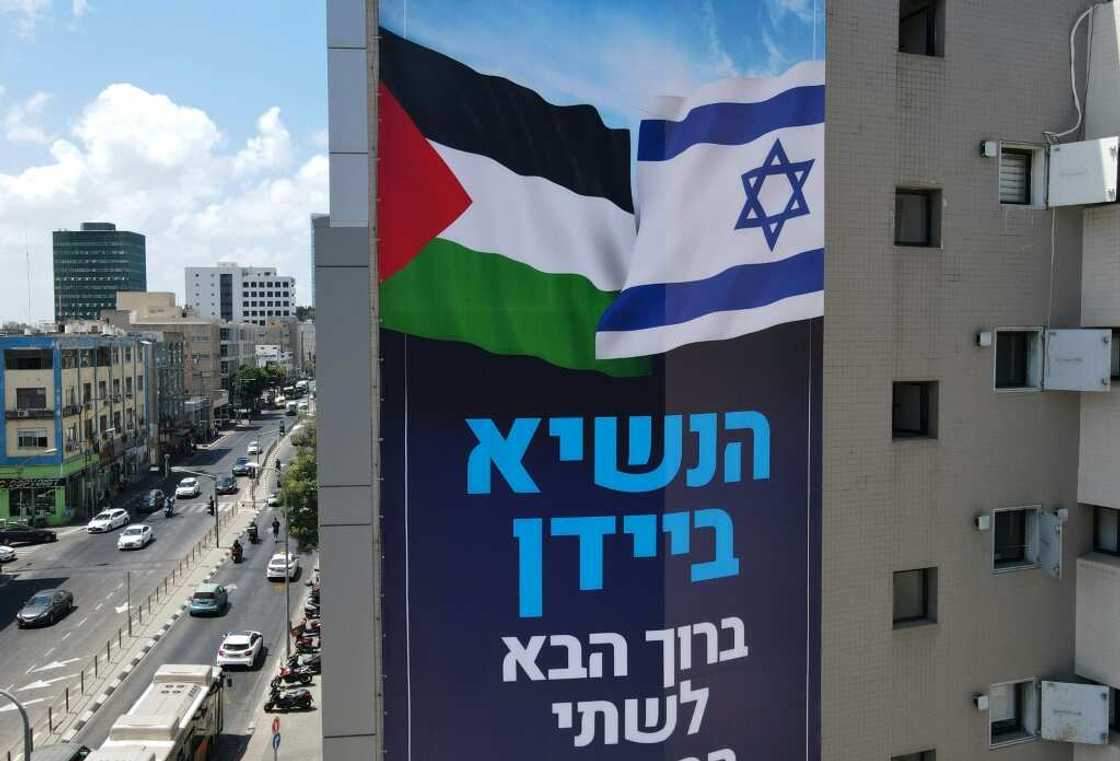 A billboard by Israeli anti-occupation group Peace Now, welcomes US President Joe Biden, in the coastal city of Tel Aviv