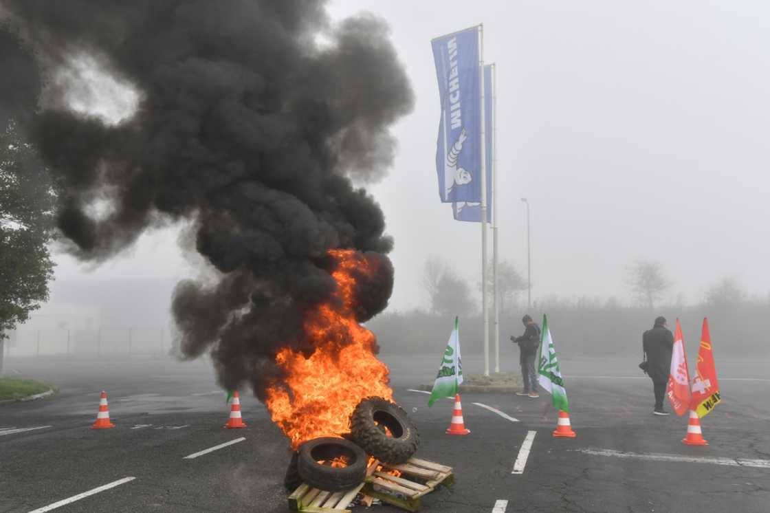 Tyres were set on fire as workers rallied outside the Michelin plant in Cholet