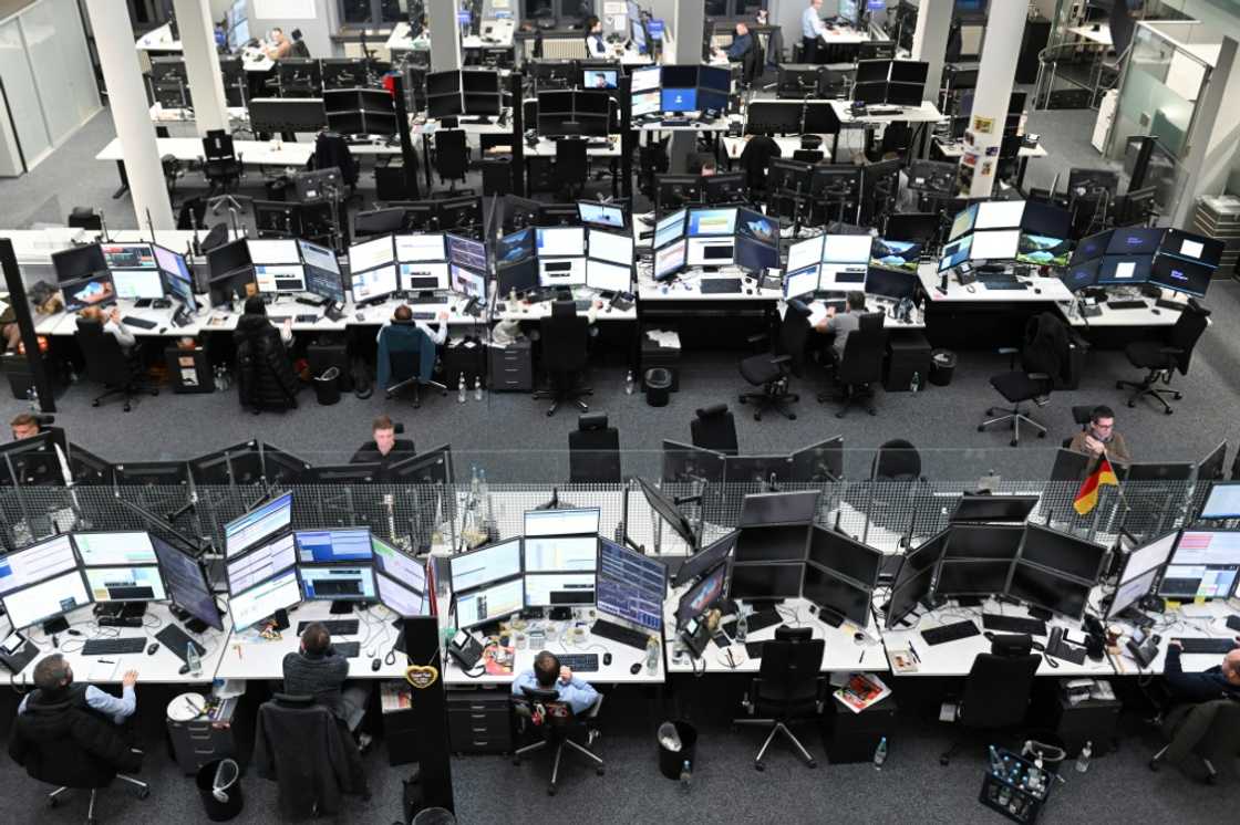 Traders work at the Stuttgart Stock Exchange Traders work at the Stuttgart Stock Exchange