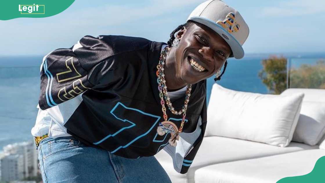 Seyi Vibez smiles while having outdoor fun