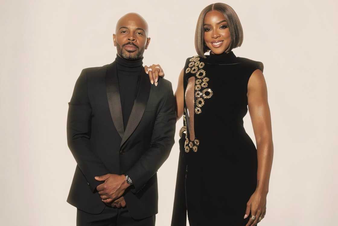 Tim Weatherspoon and Kelly Rowland pose before the Baby2Baby gala