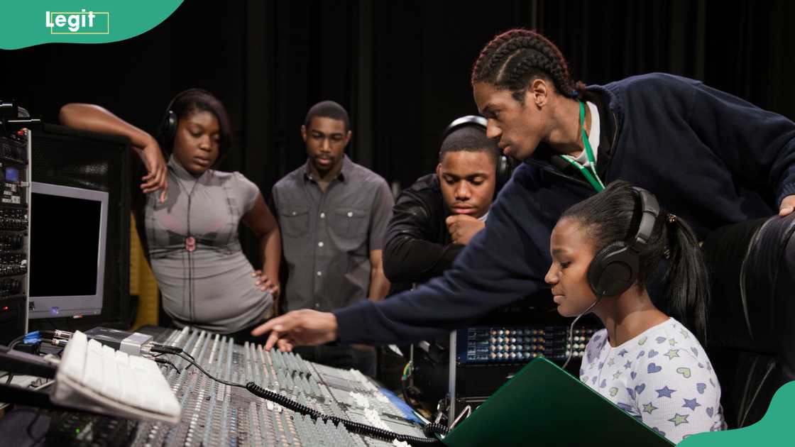Students working with a sound mixer