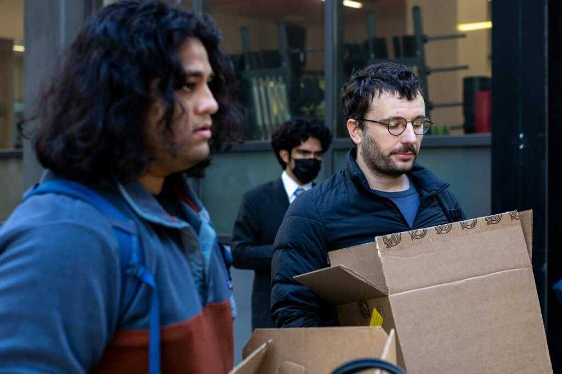 Rahul Ligma(L), software engineer, and Daniel Johnson speak with the media outside Twitter headquarters after allegedly being laid off on October 28, 2022, in San Francisco, California