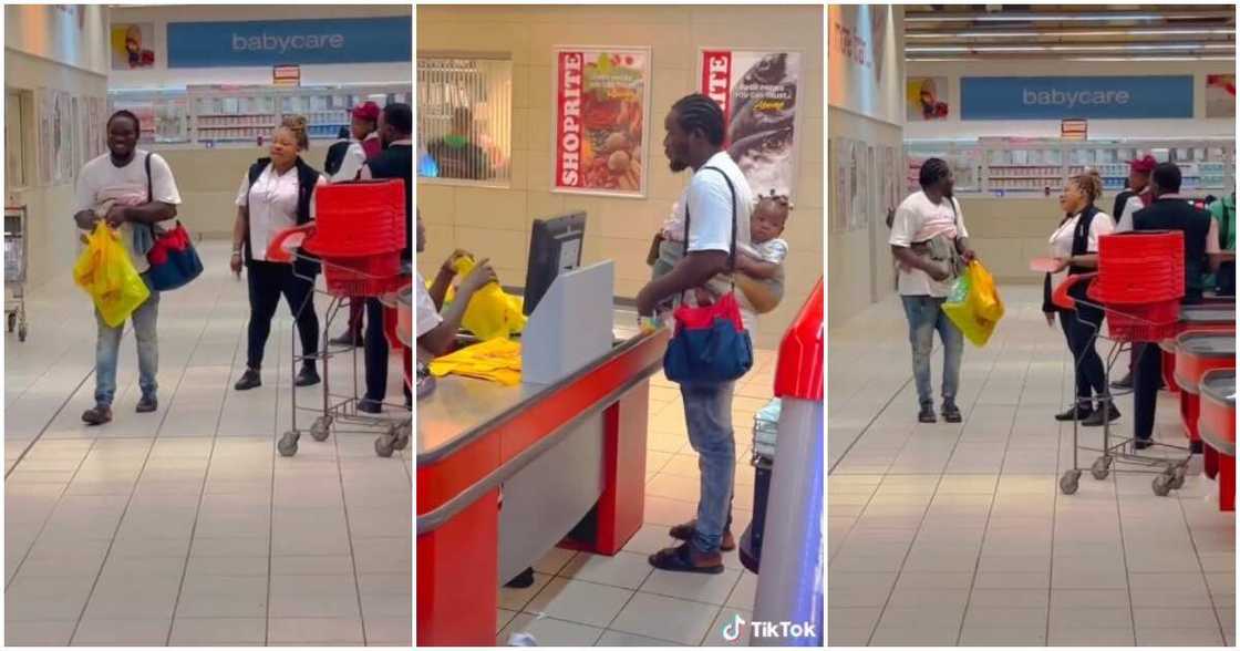 Husband material, man shops with bay on his back, man back carries baby, Ibadan mall Husband material, man shops with bay on his back, man back carries baby, Ibadan mall