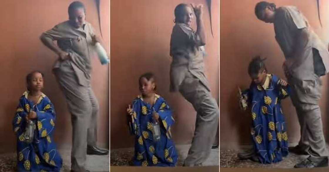Playful woman dances with her little daughter in video