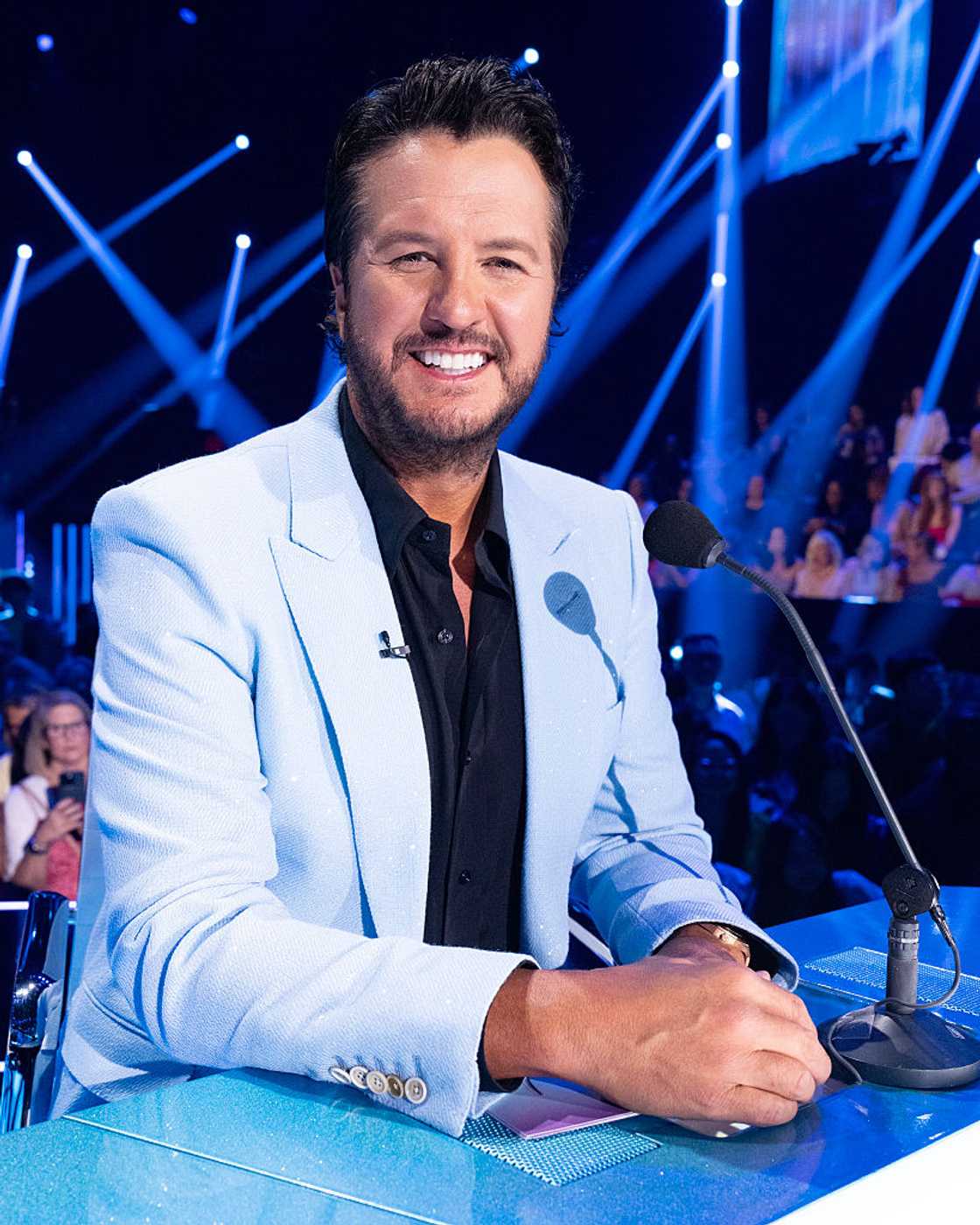 Luke Bryan smiles while looking at the camera during an "American Idol" event