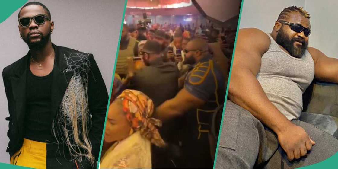 Kizz Daniel's bouncer hugs him at event. Kizz Daniel's bouncer hugs him at event.