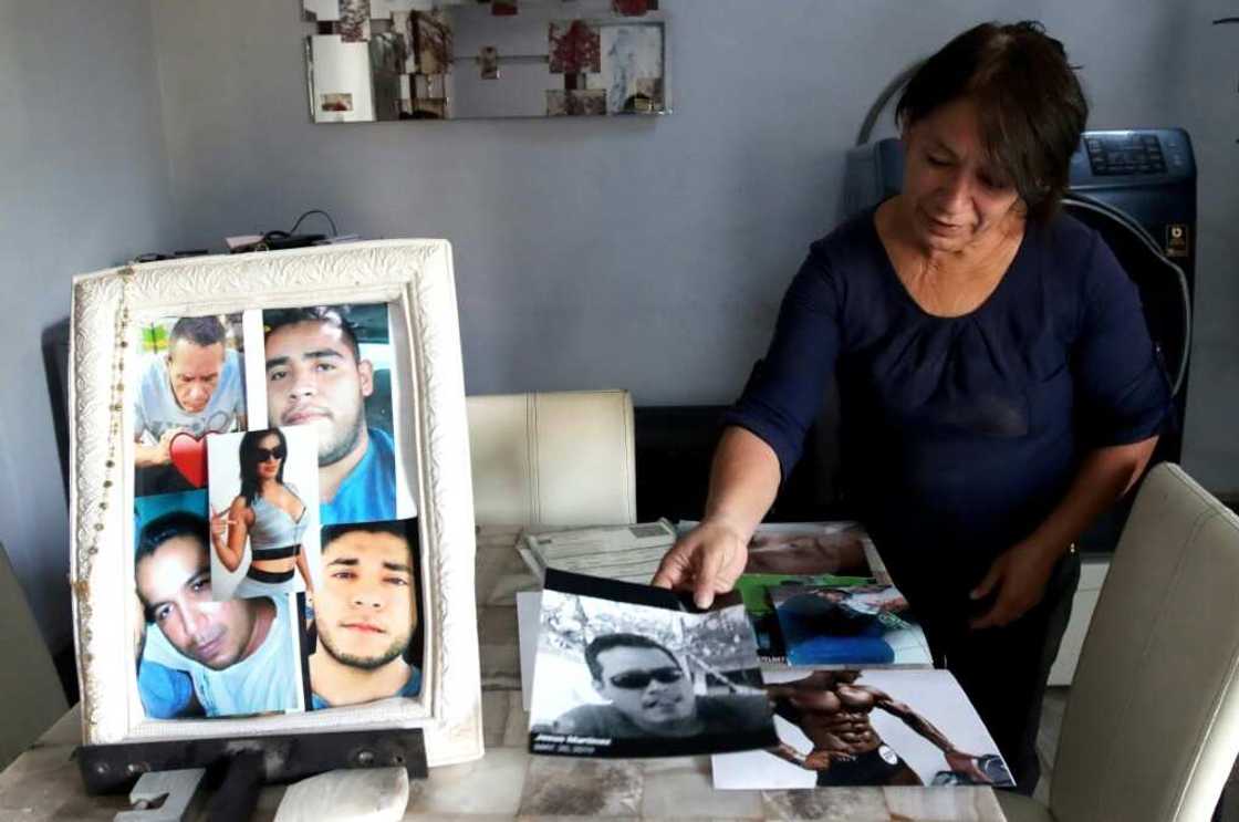Guadalupe Camarena shows pictures of her five children, who are among more than 100,000 people missing in Mexico Guadalupe Camarena shows pictures of her five children, who are among more than 100,000 people missing in Mexico