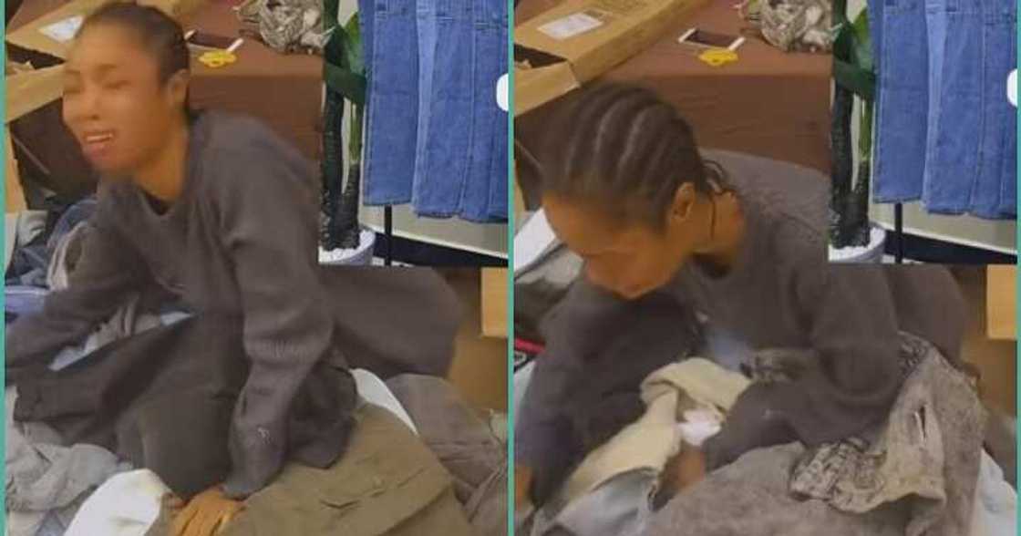 Businesswoman cries uncontrollably after opening bale of clothes