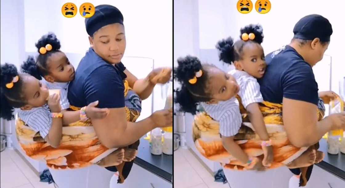 Photos of mother carrying her twin babies. Photos of mother carrying her twin babies.