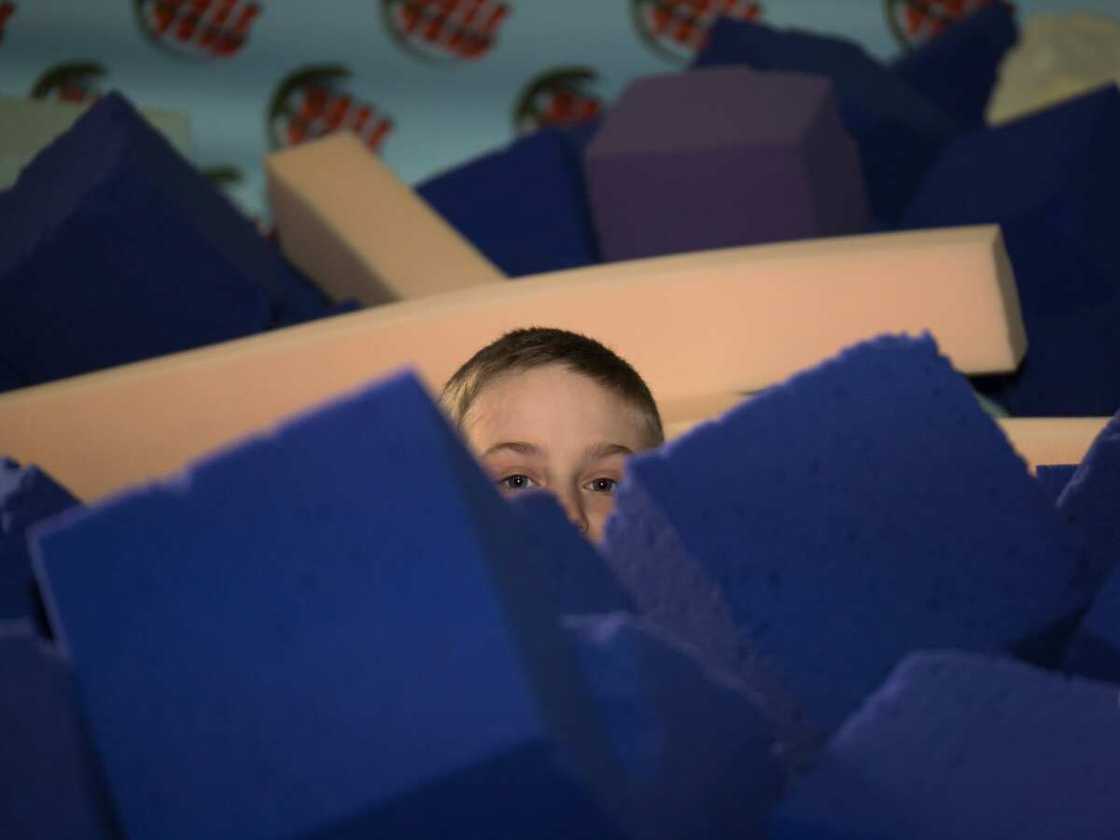 Head of a boy can see between the cubes Head of a boy can see between the cubes