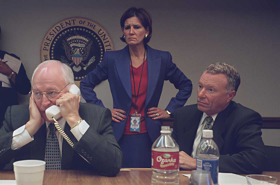 Vice President Cheney speaks on the phone while Mary Matalin stands, and Lewis Libby looks on. Vice President Cheney speaks on the phone while Mary Matalin stands, and Lewis Libby looks on.