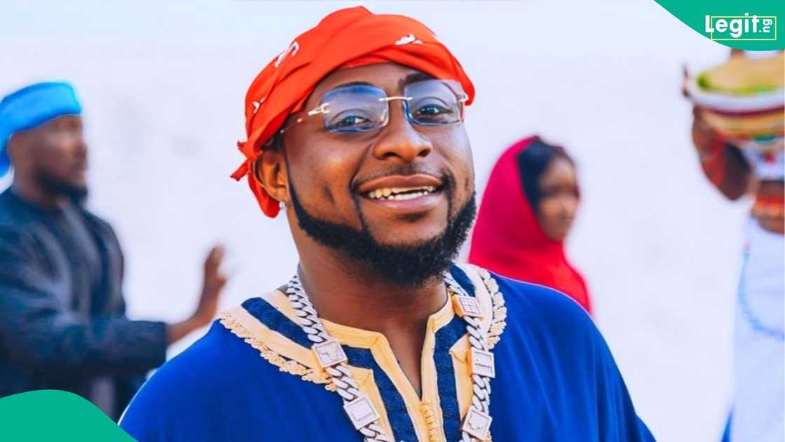 Davido poses with two customised Ferrari Roma and Purosangue luxury cars