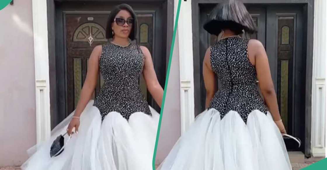Lady rocks a stylish black and white dress Lady rocks a stylish black and white dress