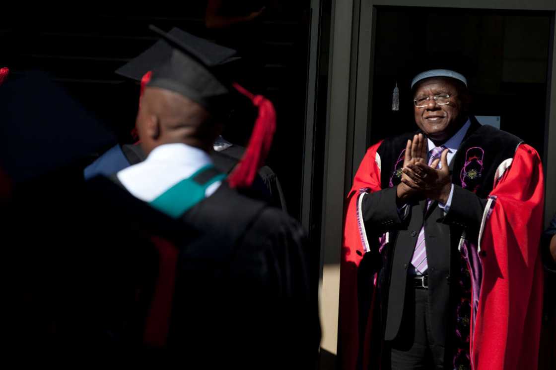 A professor congratulating a student on his graduation