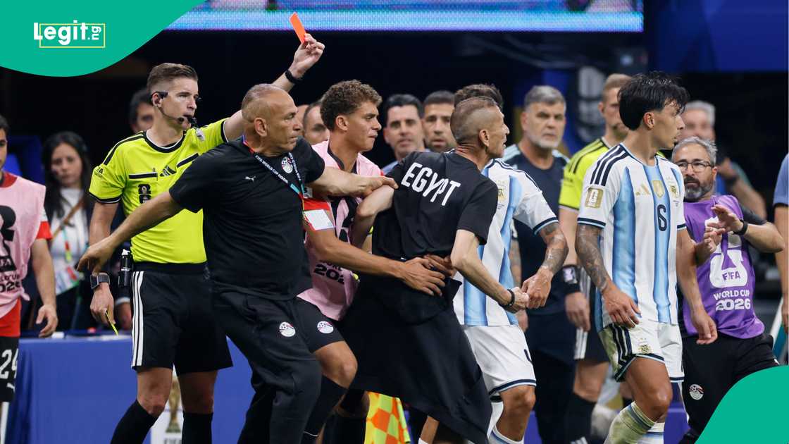 Head Coach of Egypt Hossam Hassan speaks to Referee Francois Letexier after being shown a yellow card against Argentina. Photo by Catherine Ivill Head Coach of Egypt Hossam Hassan speaks to Referee Francois Letexier after being shown a yellow card against Argentina. Photo by Catherine Ivill