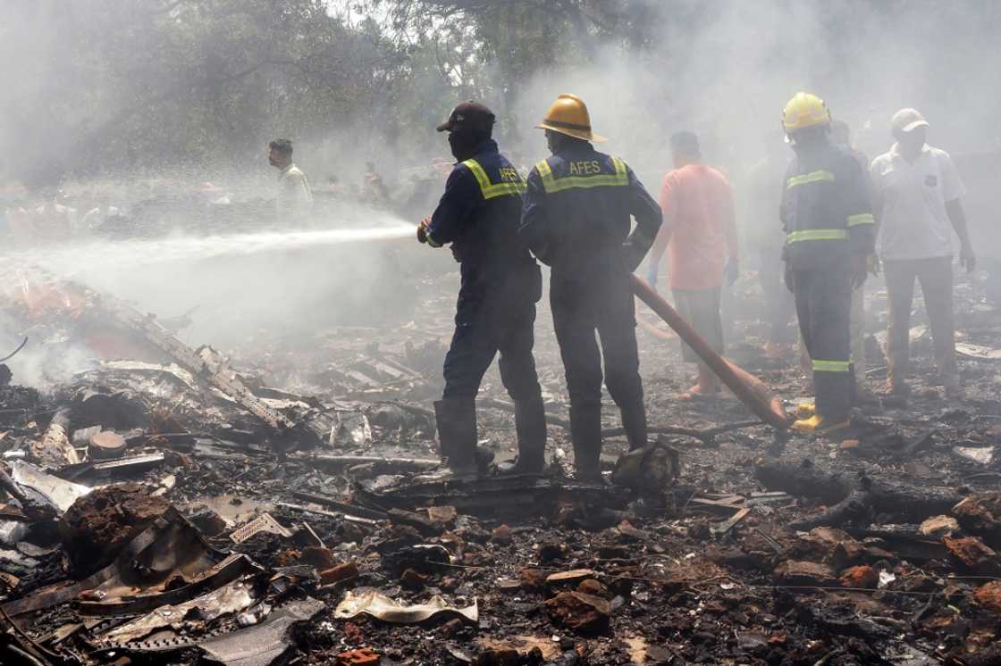 Firefighters at the site of the Air India crash Firefighters at the site of the Air India crash