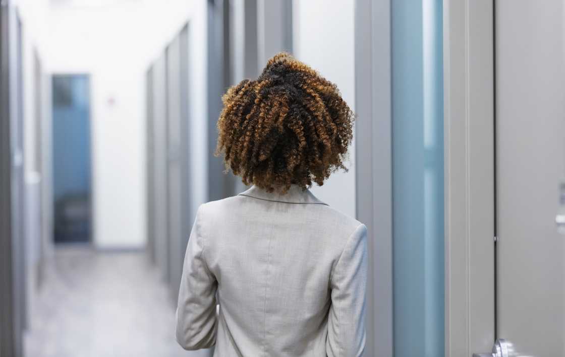 A woman walking down the hallway