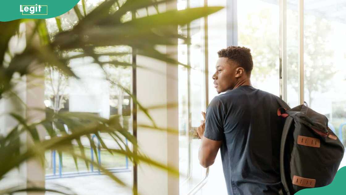A university student looking through the window A university student looking through the window