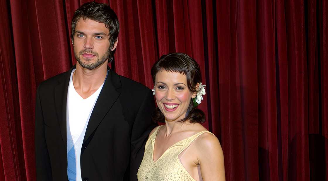 Alyssa Milano and Josh Shambaugh pose on the red carpet of the Capitol/Virgin Records Grammy party. Alyssa Milano and Josh Shambaugh pose on the red carpet of the Capitol/Virgin Records Grammy party.