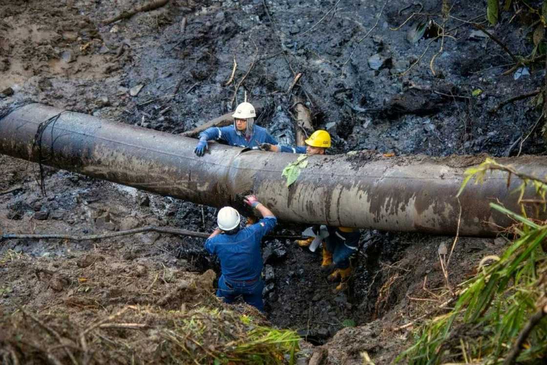 Handout picture released by the State Petroleum Company of Ecuador (EP Petroecuador) showing workers repairing a pipeline in El Reventador, Sucumbios province, Ecuador, on June 16, 2025. Handout picture released by the State Petroleum Company of Ecuador (EP Petroecuador) showing workers repairing a pipeline in El Reventador, Sucumbios province, Ecuador, on June 16, 2025.