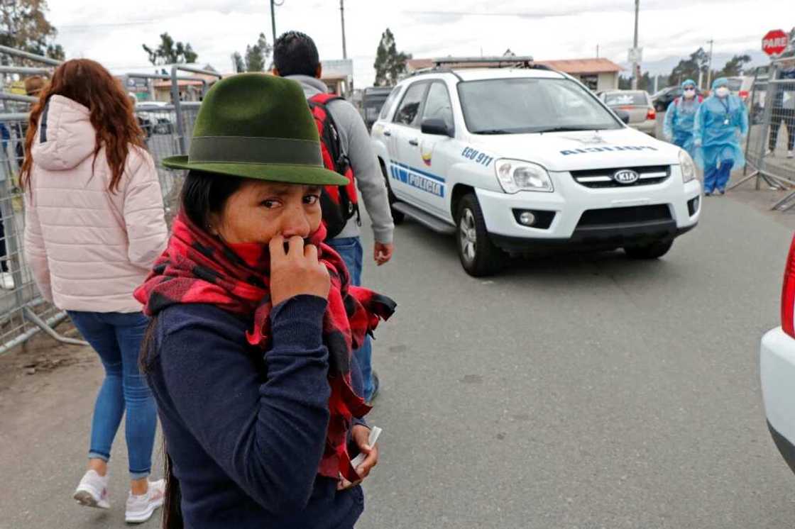 A relative of an inmate waits for news of her loved one after fresh clashes inside A relative of an inmate waits for news of her loved one after fresh clashes inside