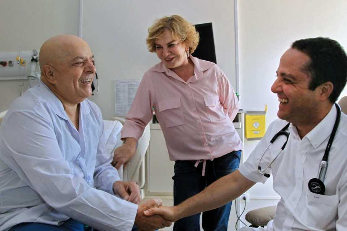 Lula (left) with his doctor and late wife  Marisa Leticia during his cancer treatment in 2011 Lula (left) with his doctor and late wife  Marisa Leticia during his cancer treatment in 2011