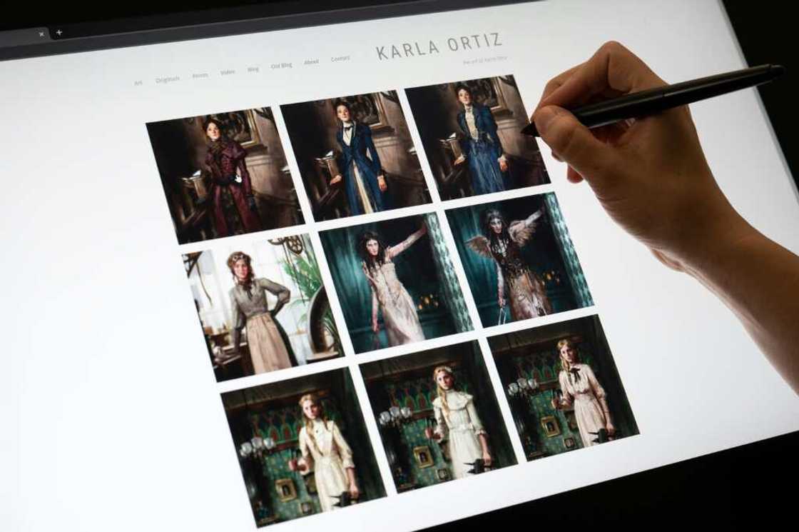 Karla Ortiz shows her website, where some of her designs and illustrations are displayed Karla Ortiz shows her website, where some of her designs and illustrations are displayed
