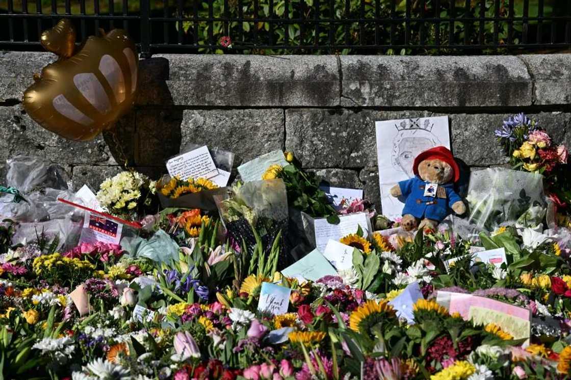 A nation mourns -- floral tributes and a toy Paddington bear outside Balmoral Castle, the Scottish retreat where Queen Elizabeth II died A nation mourns -- floral tributes and a toy Paddington bear outside Balmoral Castle, the Scottish retreat where Queen Elizabeth II died