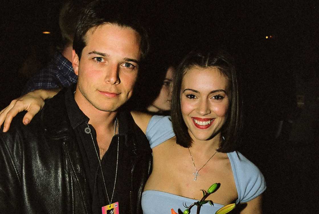 Scott Wolf and Alyssa Milano hold each other during a concert. Scott Wolf and Alyssa Milano hold each other during a concert.