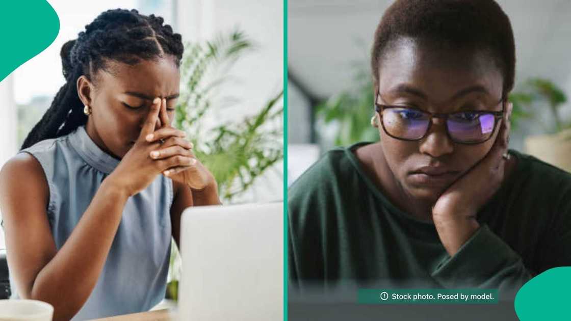 A stressed Nigerian office worker alone at their desk, representing poor psychological safety. A stressed Nigerian office worker alone at their desk, representing poor psychological safety.