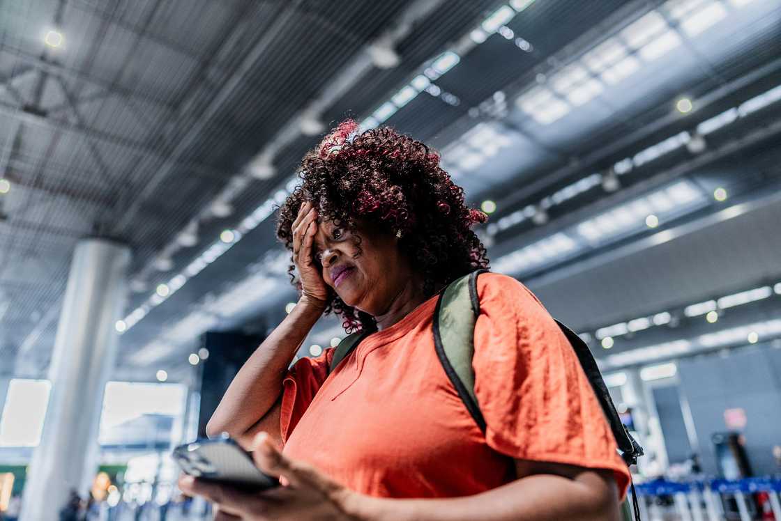 A tense woman in an airport