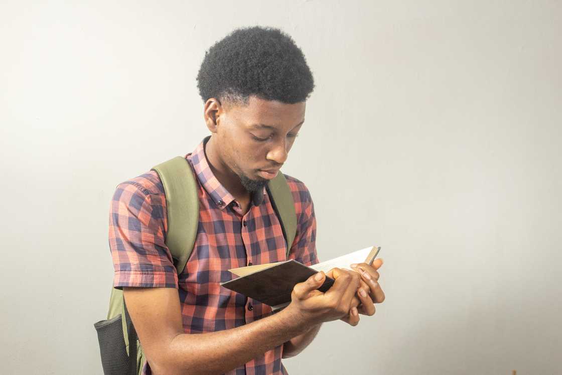 A young man reading a book