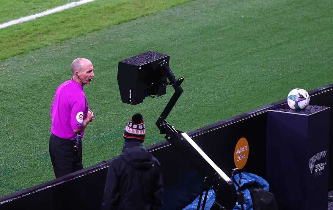 Mike Dean in action in the Premier League. Mike Dean in action in the Premier League.